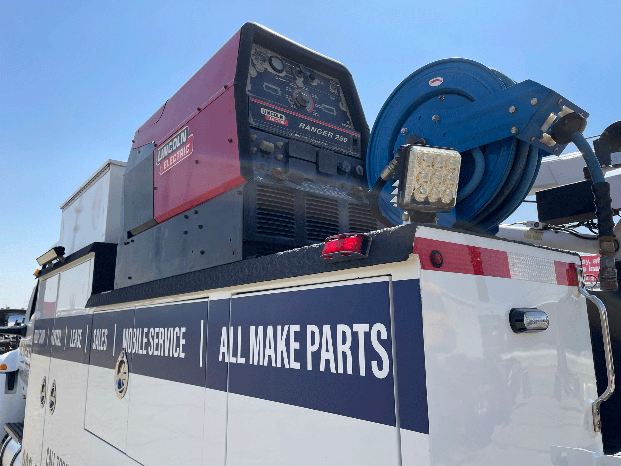 Our service truck body with a welder, and air line mounted to the body.