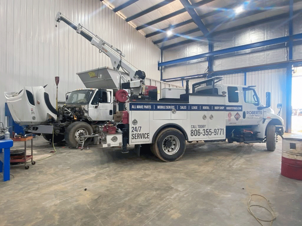 Our service truck with the crane deployed at a customer's shop.